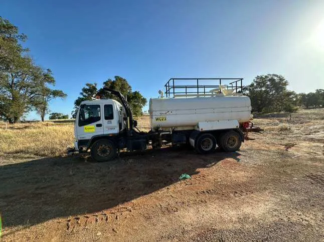Water cart supporting dust suppression on site